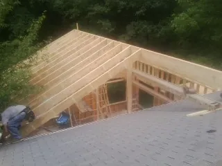 Framing a new roof addition that ties into an existing shingle roof in Lorain